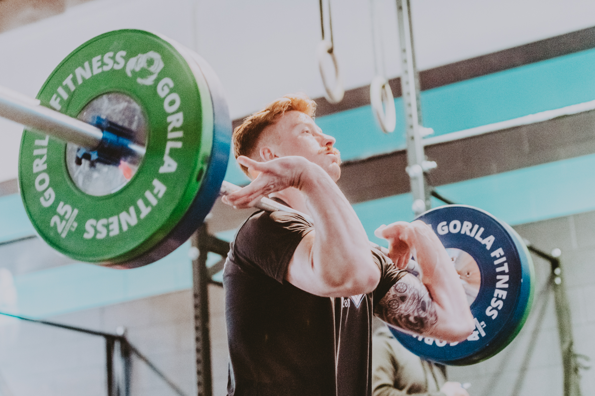 Hot red head guy doing cleans -Victoria BC Crossfit Gym 